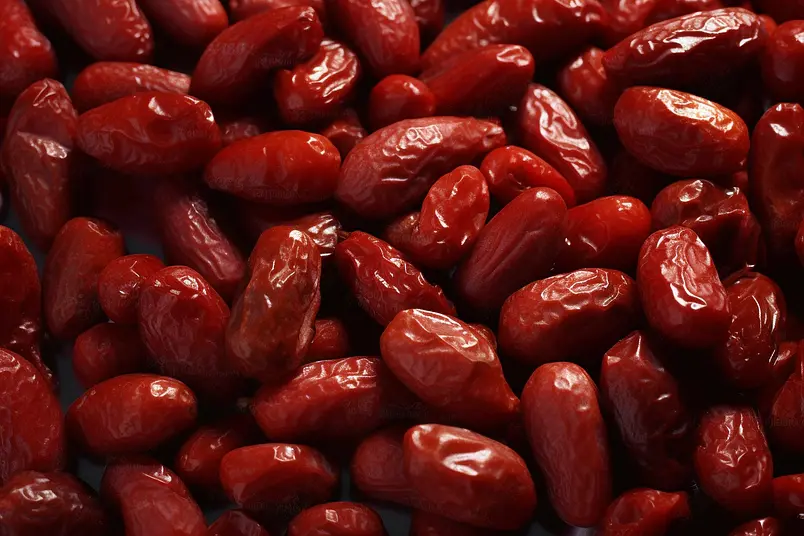新疆大枣红枣蜜枣干货红色背景摄影图