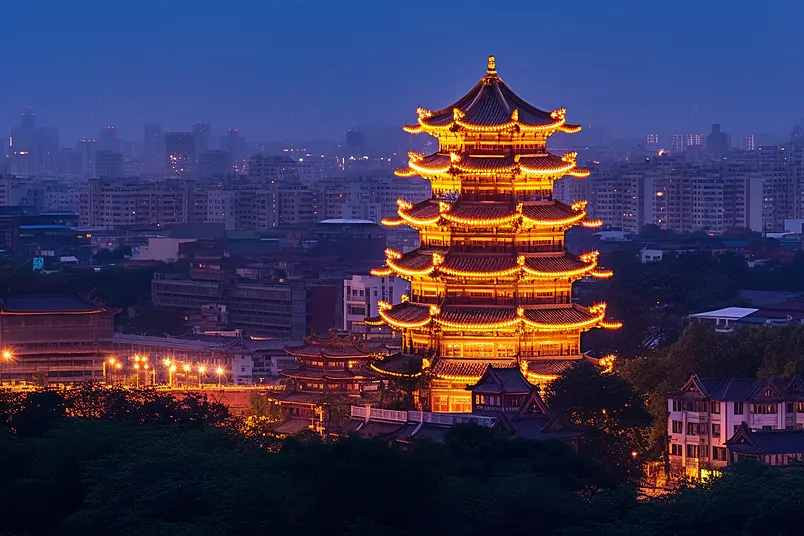 灯光全开的矗立在繁华城市的古楼建筑夜色