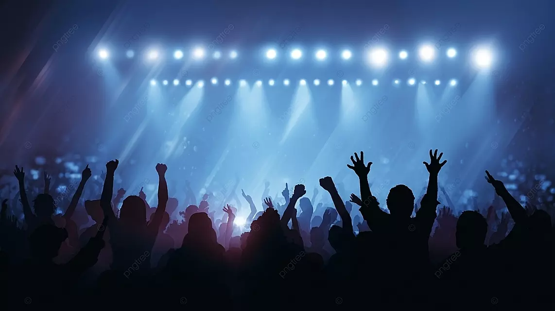 音乐会人群的轮廓在充满活力的舞台灯下